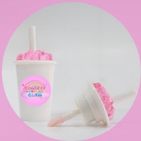 a pink cup with a pink ice cream in it